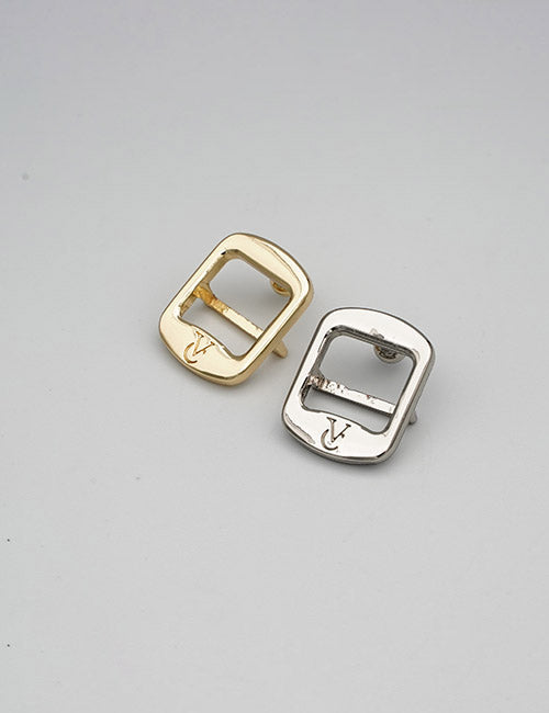 Two square-shaped Rings & Slides by YIPAI, resembling belt buckles—one gold, one silver—each engraved with a V in the lower corner, displayed on a plain light grey background.