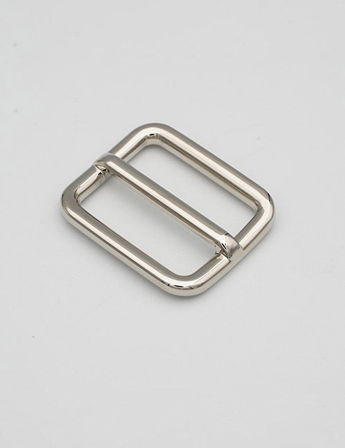 The YIPAI Rings & Slides is a shiny, silver rectangular belt buckle with rounded edges and a central bar, displayed on a plain light gray background.
