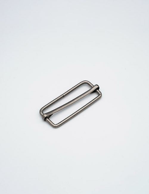A YIPAI Rings & Slides metal rectangular belt buckle with a central bar is displayed on a plain light gray background.