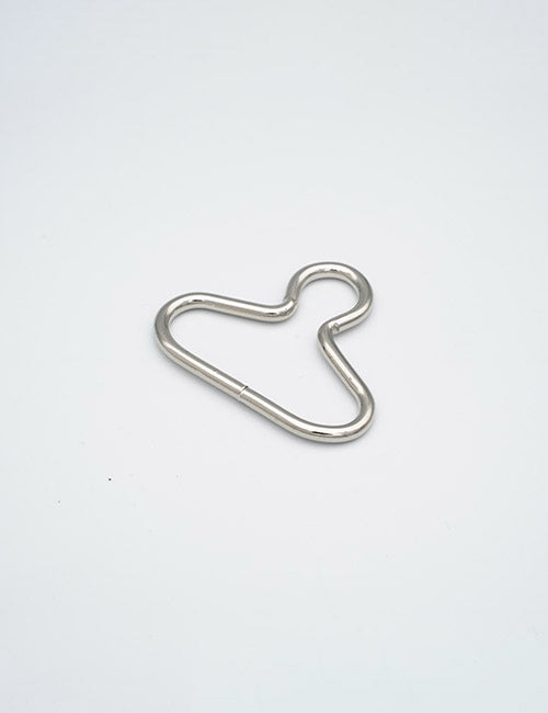 The YIPAI Rings & Slides features a silver metal wire bent into an abstract, irregular shape resembling a stylized animal outline, showcased against a plain white background.