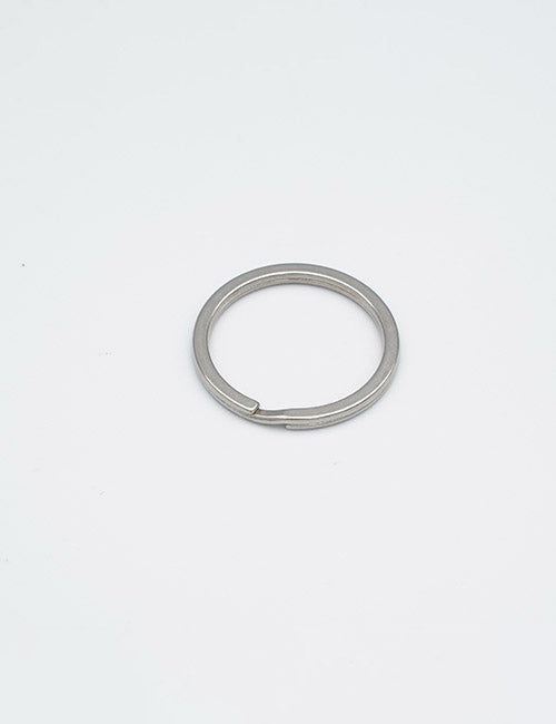 A YIPAI Rings & Slides silver metal key ring is displayed flat on a plain white background.