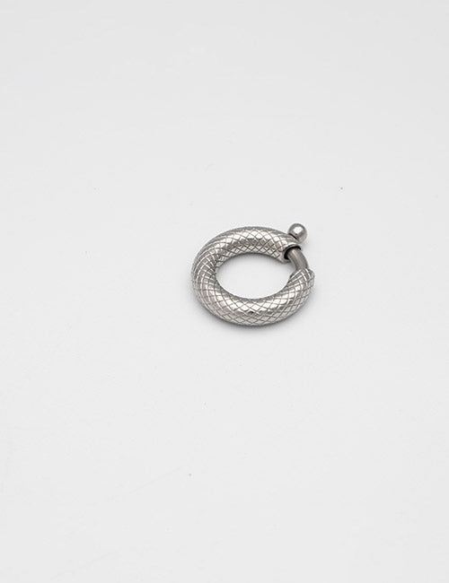 A small, textured silver hoop earring with a clasp from YIPAIs Rings & Slides collection lies on a plain white background.