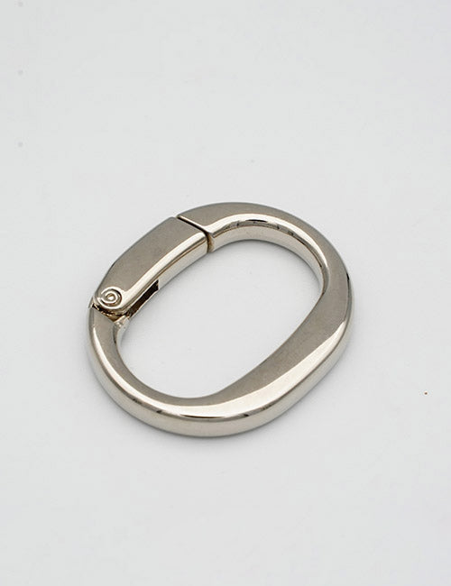 The YIPAI Rings & Slides is a shiny silver oval-shaped carabiner with a hinge clasp, displayed on a plain light gray background.