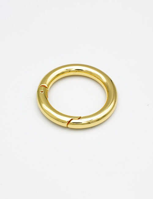 The YIPAI Rings &Slides earring features a single, round gold hoop with a smooth, polished finish. Shown on a plain white background, its hinge and clasp mechanism are clearly visible on one side.