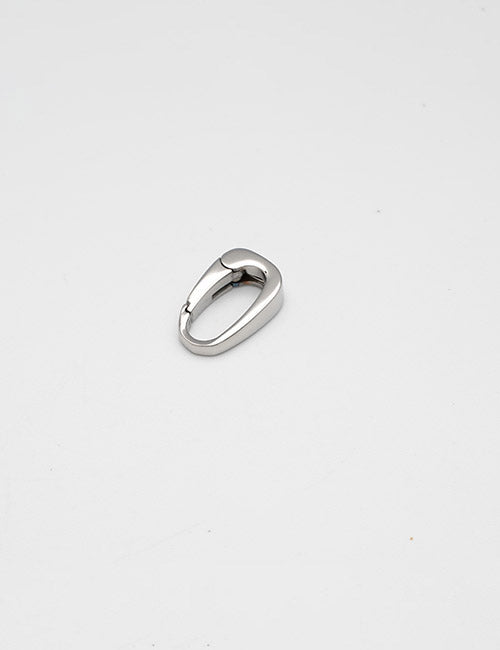 A YIPAI Rings & Slides small silver oval-shaped carabiner rests closed on a plain white surface.
