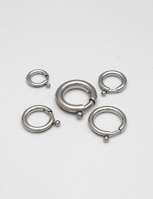 Five YIPAI Rings & Slides silver hoop earrings of different sizes, each featuring a small ball clasp, are displayed on a plain white background.