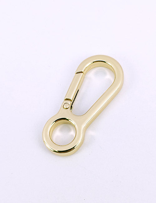 A YIPAI Snap Hooks gold metal carabiner with a spring-loaded gate, ideal for attaching items, is displayed on a plain white background.