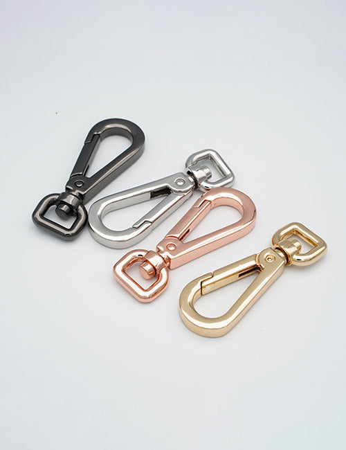 YIPAI Snap Hooks in black, silver, rose gold, and gold are shown on a white background. Each metal hook features a rectangular ring on one end and a clasp on the other.