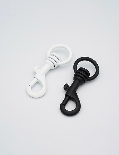 Two YIPAI Snap Hooks, one black and one white, are shown side by side on a plain white background. Each hook features a spring-loaded clasp and a circular ring at the top.