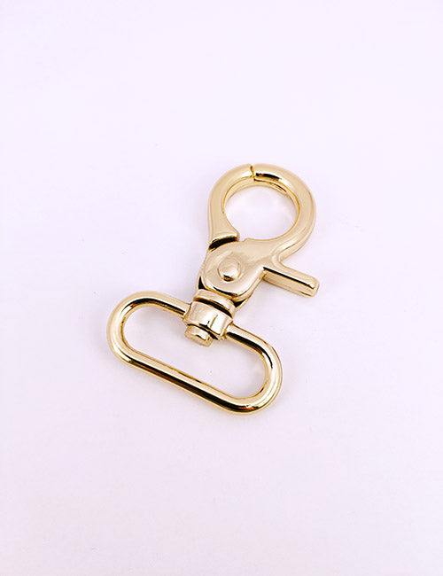 A YIPAI Snap Hook with a shiny gold finish, spring-loaded lever, and oval base loop is shown on a plain light background.