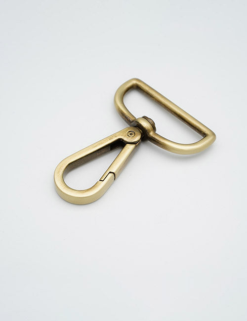 The YIPAI Snap Hooks, featuring a brass swivel clasp with a D-ring, are displayed on a plain white background at an angle to highlight their simple and functional design.